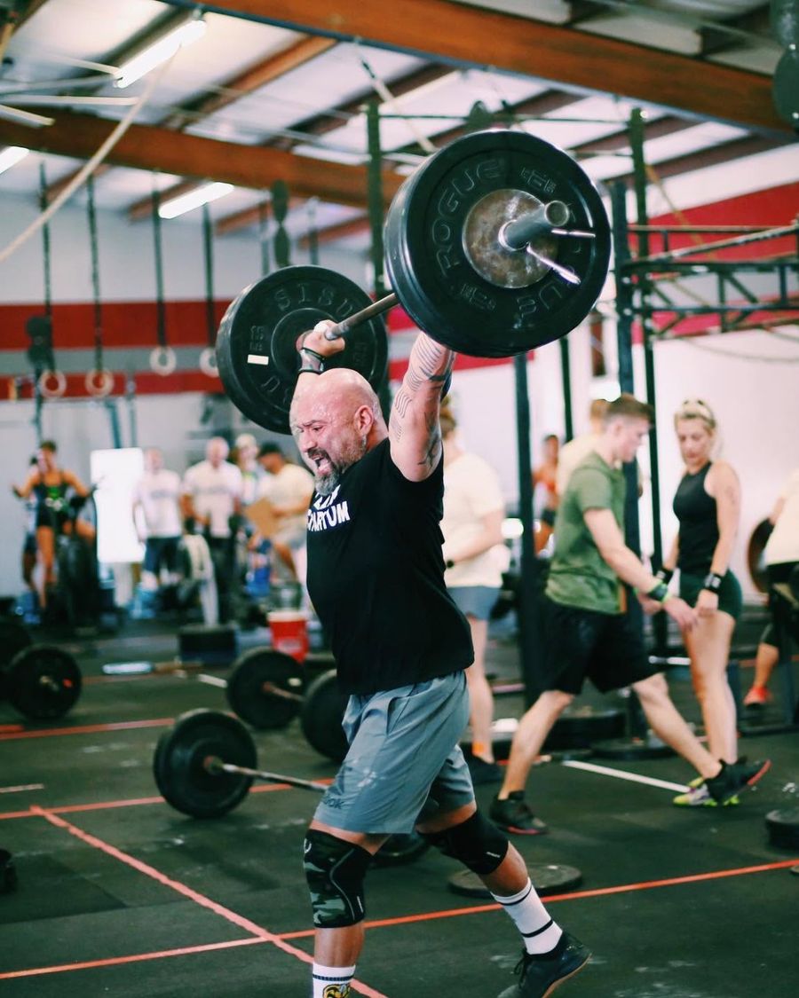 Athletes competing across a marked competition floor at a Garage Games event